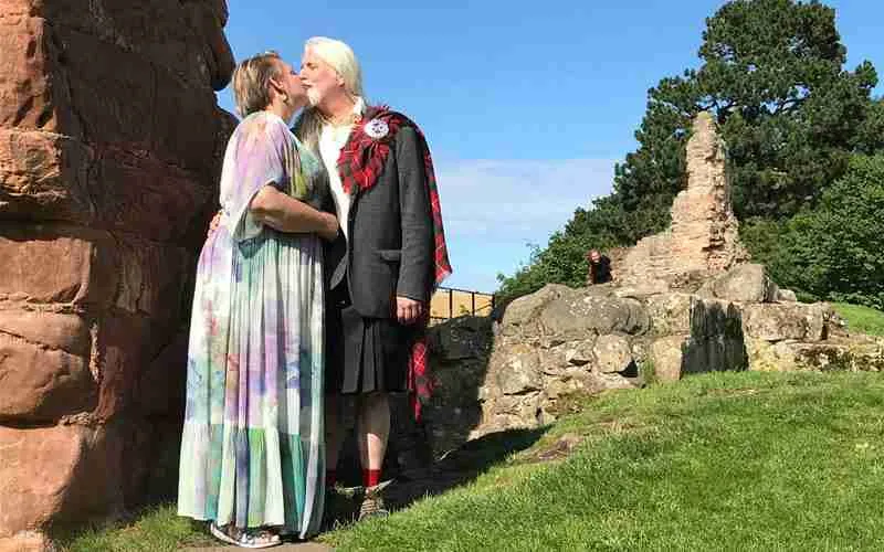 Couple celebrating their Scottish marriage at Hailes Castle