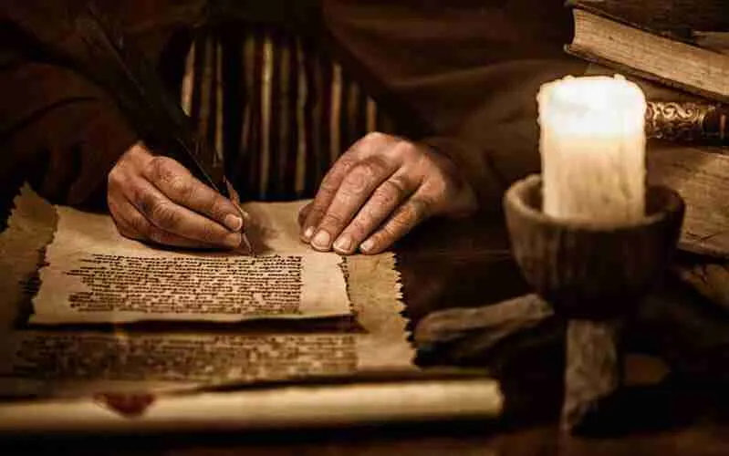 A clerk writing on paper 