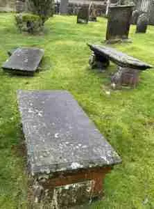 Table top gravestones in the Fossoway parish St Serf & Devonside cemetery.