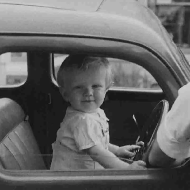 Young child in car with father