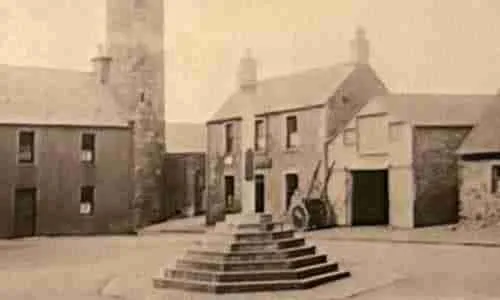 Old photo of he war memorial as the mercat cross in Abernethy Scotland