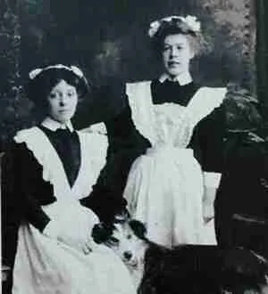 Two Victorian servants, possibly housemaids, from a postcard.